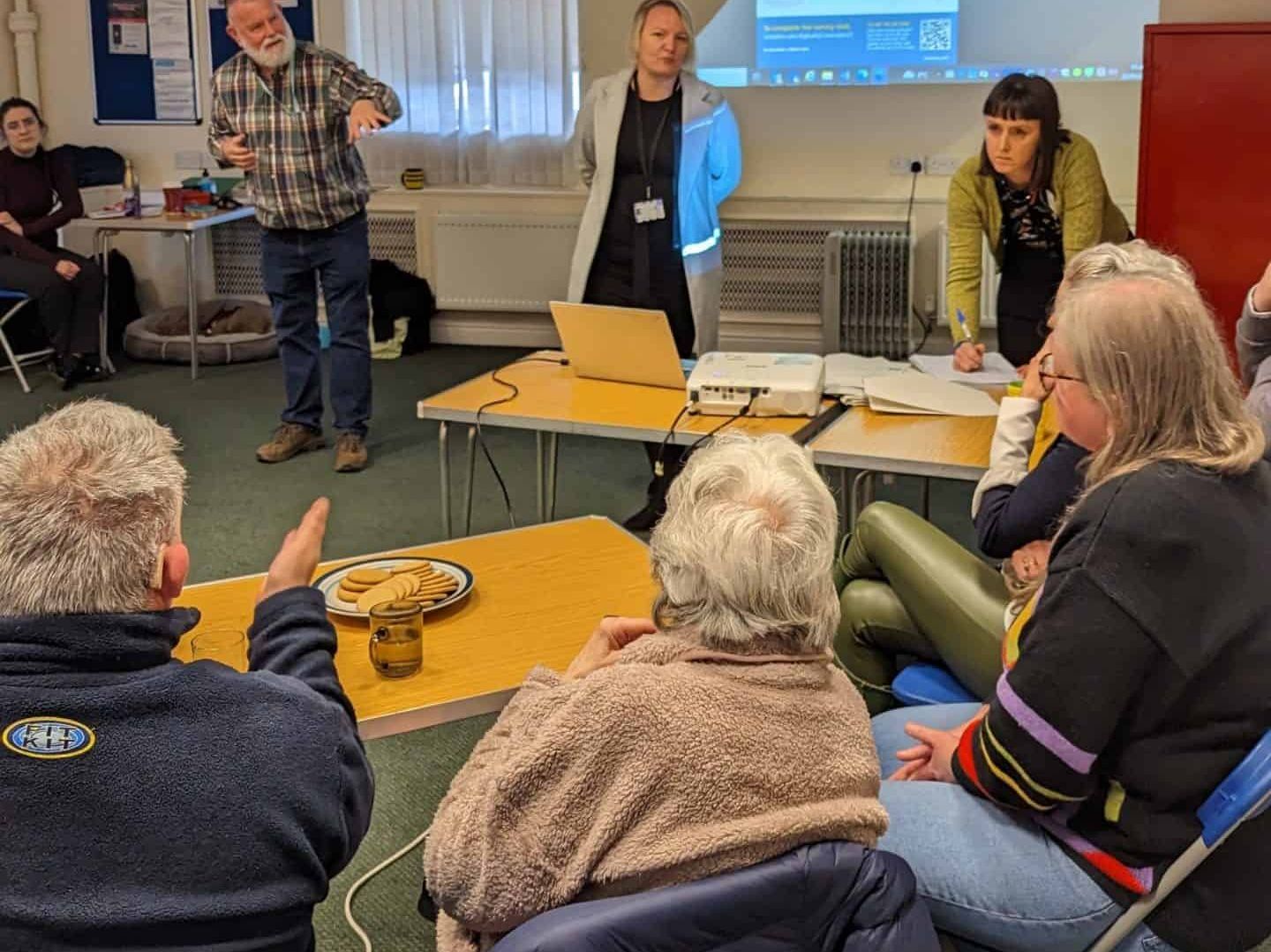 Group of people at a Hub chatting and socialising