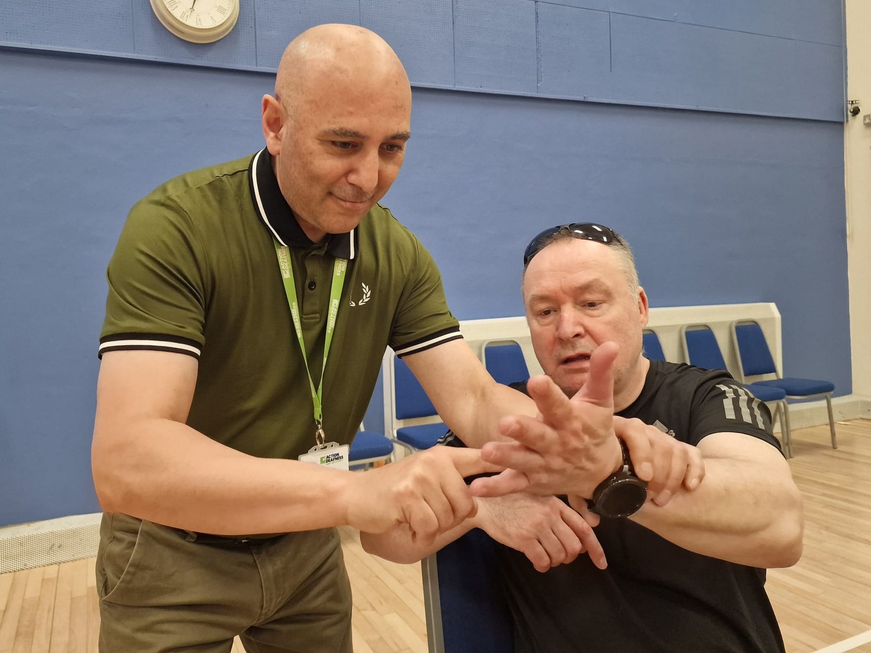 Deafblind alphabet staff and client communicating