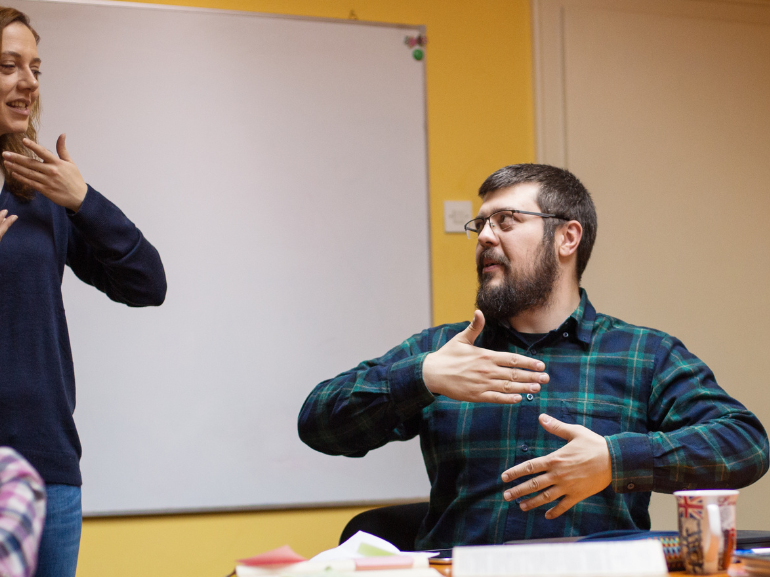 Person signing and interpreter